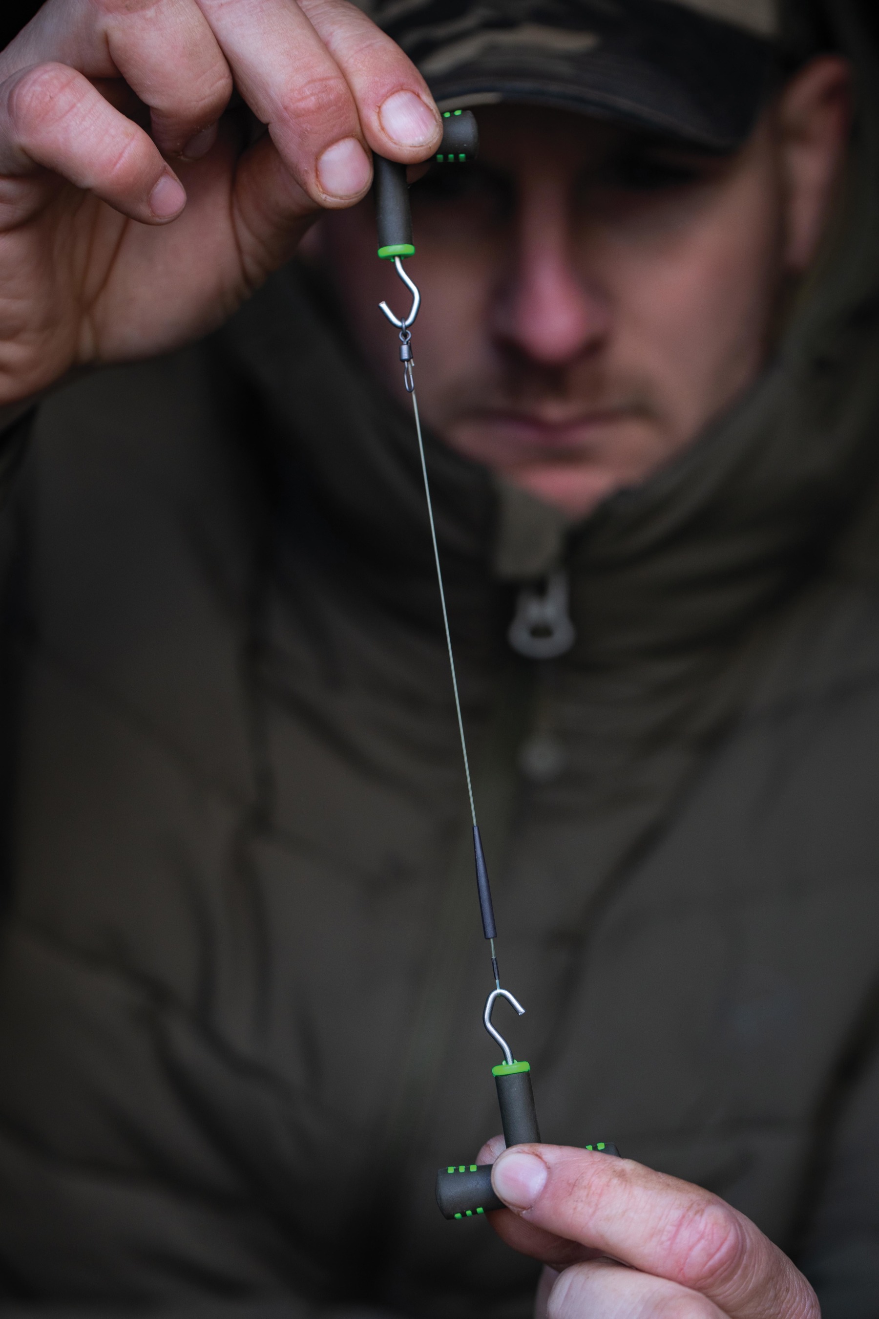 2. At the other end, thread on an anti-tangle sleeve and crimp a loop like so.