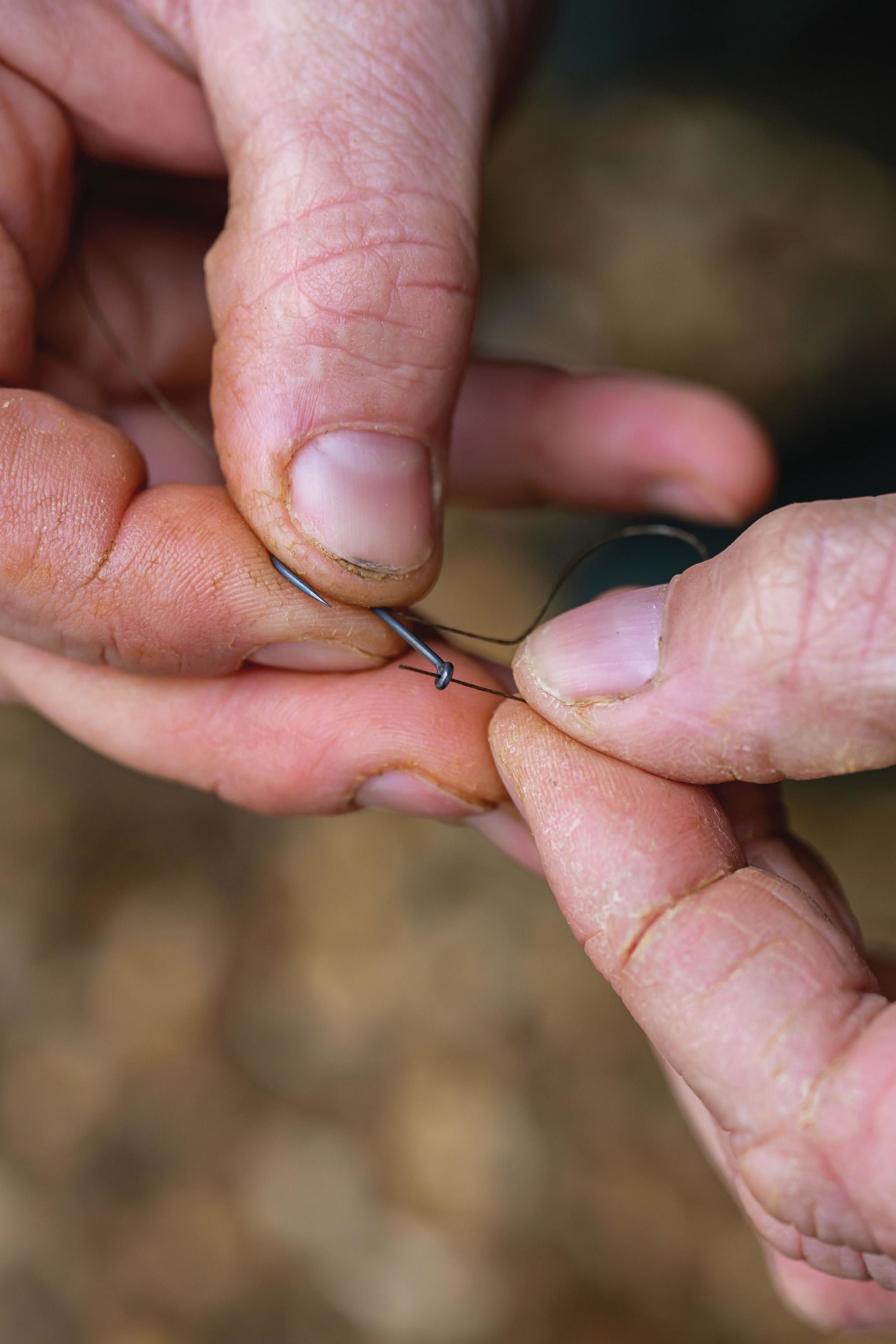 Secure the hook using a Three-Turn Knotless Knot.