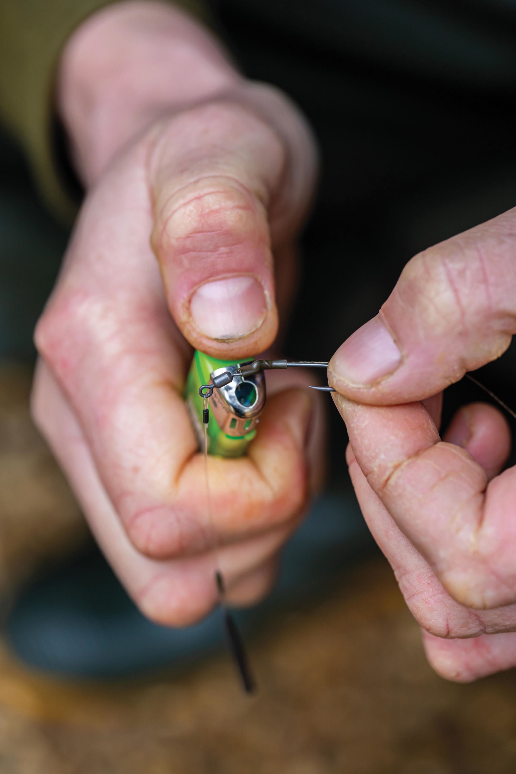Cover the hook eye and swivel hook with the shrink tube.