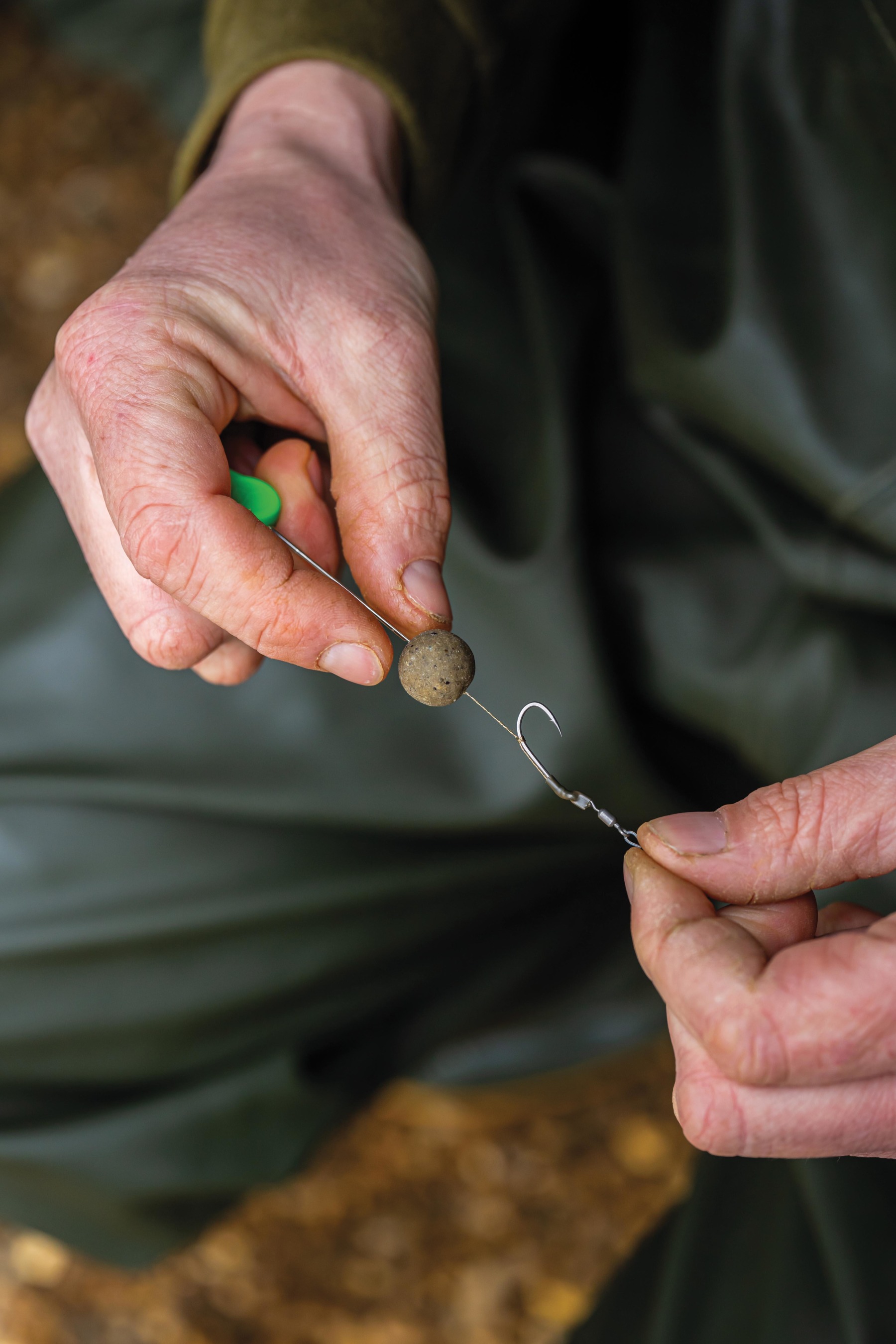 Slide your bottom bait onto the hair using a baiting needle.