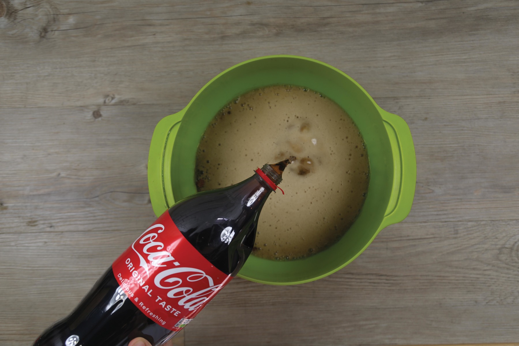 2. Add enough full-fat Coke to cover the nuts by at least 6- or 7-inches.